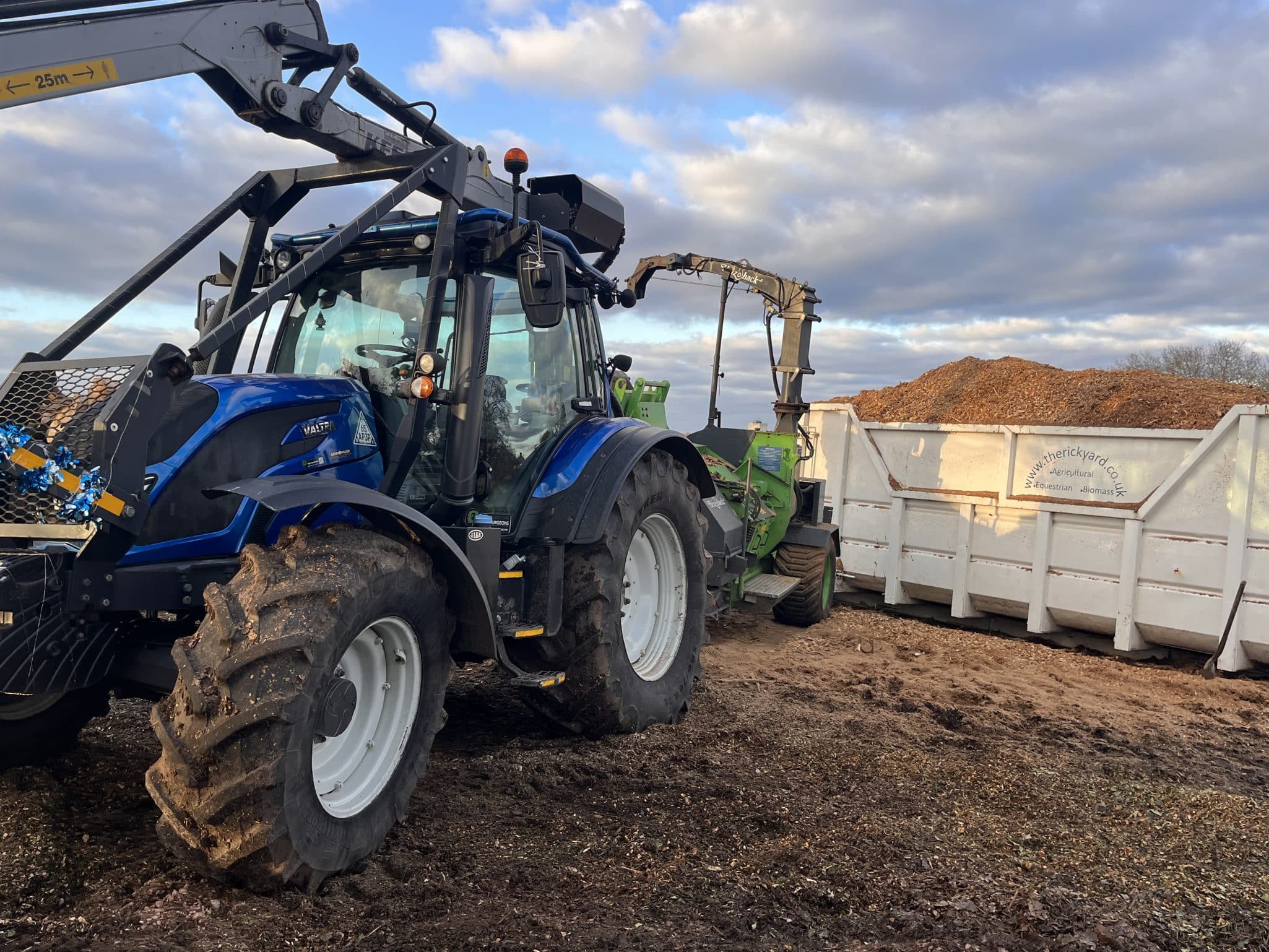 mulch delivery next to tractor